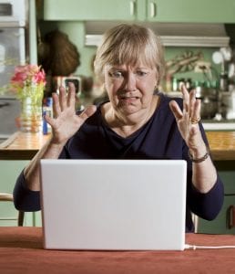 Shocked Senior Woman with a Laptop Computer