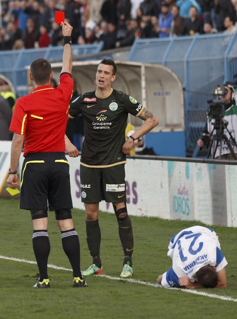 BUDAPEST, HUNGARY - MARCH 8, 2014: Red card for Julian Jenner of Ferencvaros during MTK Budapest vs. Ferencvaros OTP Bank League football match at Hidegkuti Stadium on March 8, 2014 in Budapest, Hungary.