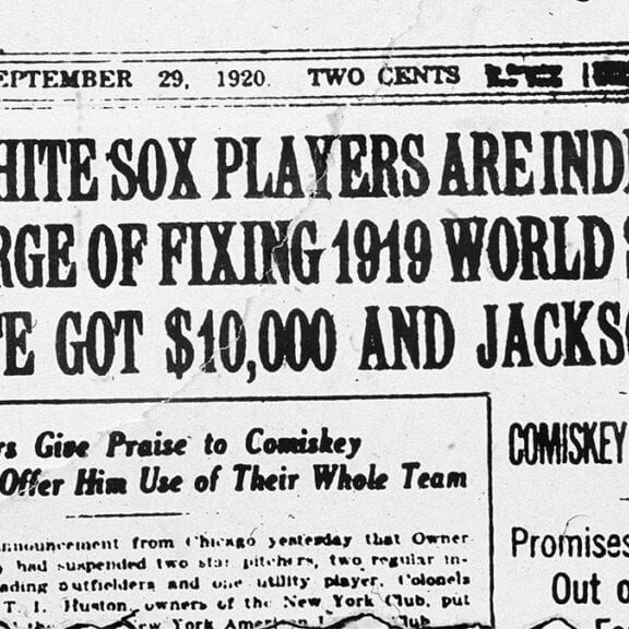 Frontpage headline of the New York Times newspaper describing the so-called 'Black Sox' scandal in which players of the American League's Chicago White Sox threw the World Series reads 'Eight White Sox players are indicted on charge of fixing 1919 World Series; Cicotte got $10,000 and Jackson $5,000. Comiskey suspends them; Promises to run them out of baseball if found guilty,' September 29, 1920. Inset headline reads 'Yankee owners give praise to Comiskey and offer him use of their whole team.' Charles A. Comiskey was the owner of the White Sox. Pitcher Eddie Cicotte and left fielder 'Shoeless' Joe Jackson were popular and successful players involved in the scandal. (Photo by New York Times Co./Getty Images)