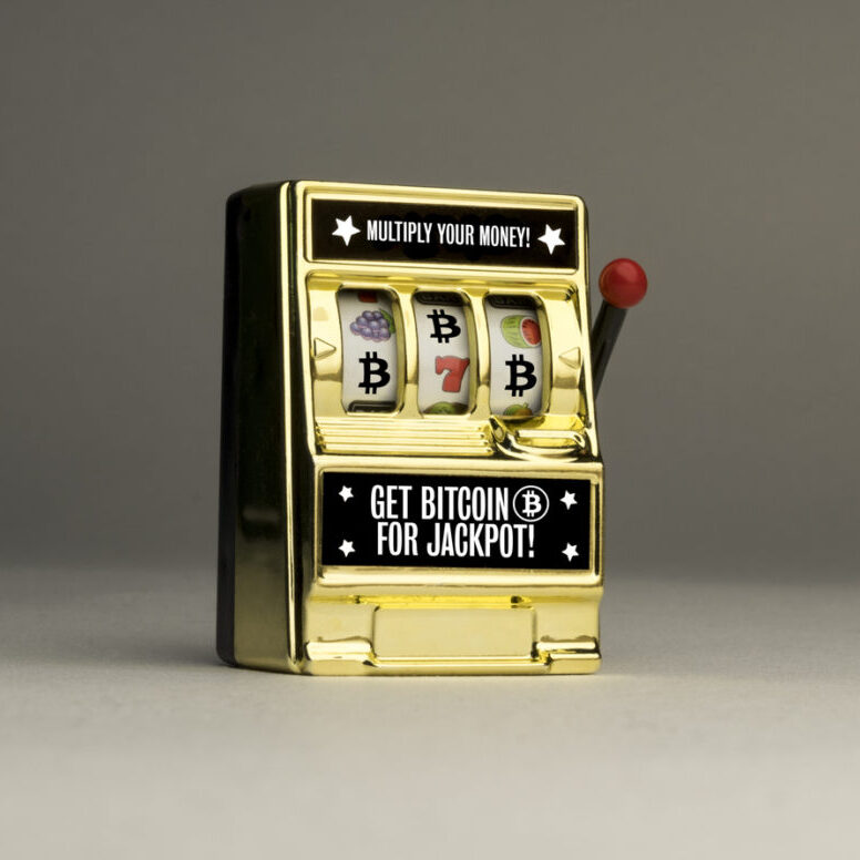 Conceptual casino one armed bandit slot machine to emphasise the reality of gambling risks with cryptocurrency and Bitcoin