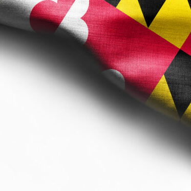 Fabric texture of the Maryland Flag background - flag on white background - right top corner - copy space