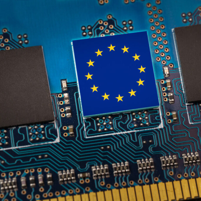 European Union flag in the center of a circuit board. Concept of leadership in technology, artificial intelligence or digital cryptocurrencies