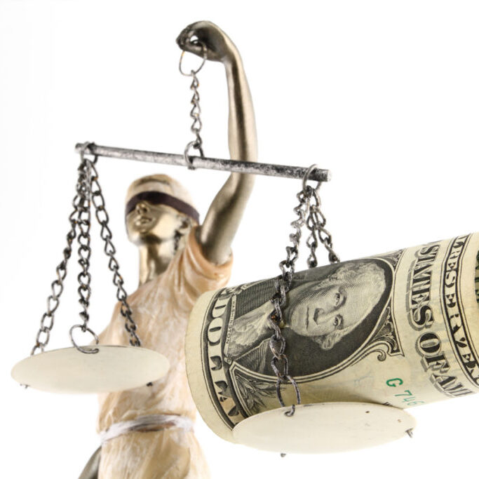 Justice (greek:themis,latin:justitia) blindfolded with scales, sword and money on one scale. Corruption and bribing concept.