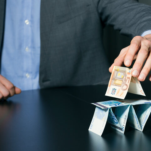 businessman building financial pyramid