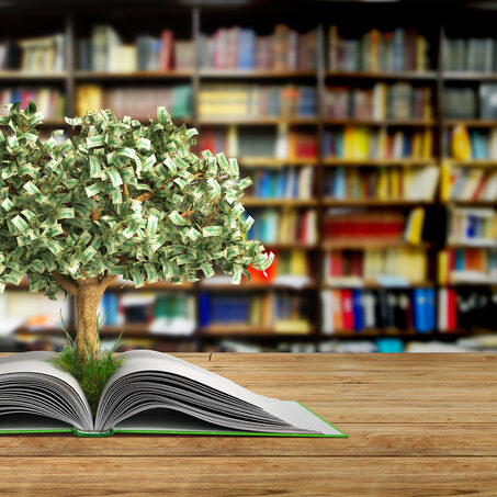 tree growing from book