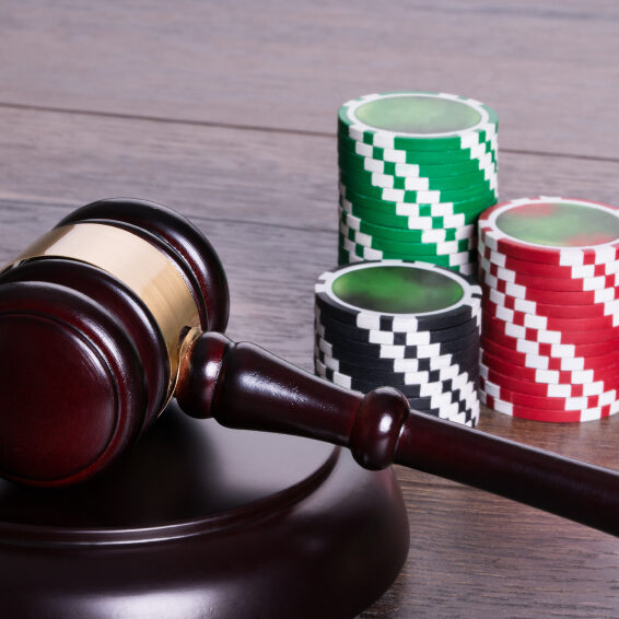 Casino chips and gavel in gambling legal concept